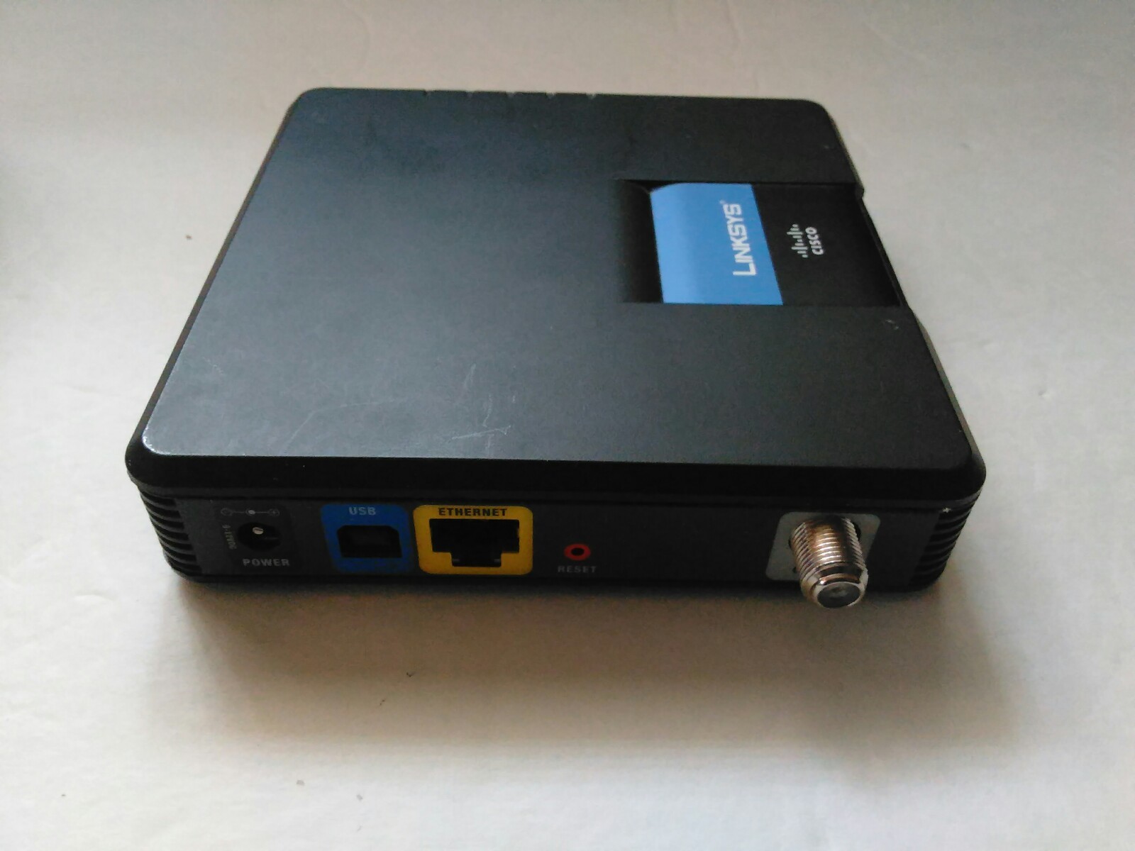 Linksys Cisco CM100 Refurbished Cable Modem With Power Cord Ethernet Cable CD