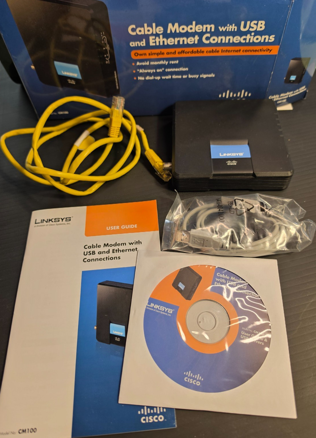 LINKSYS CISCO CM100 DOCSIS 2.0 CABLE MODEM COMPLETE IN BOX w/CD CABLES MANUAL
