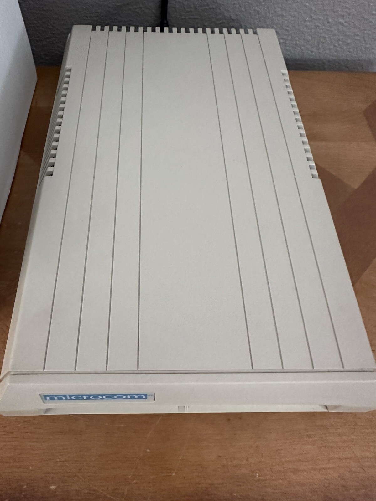 Microcom DeskPorte 14,400 bps Modem W/ Box And Charging Cord.