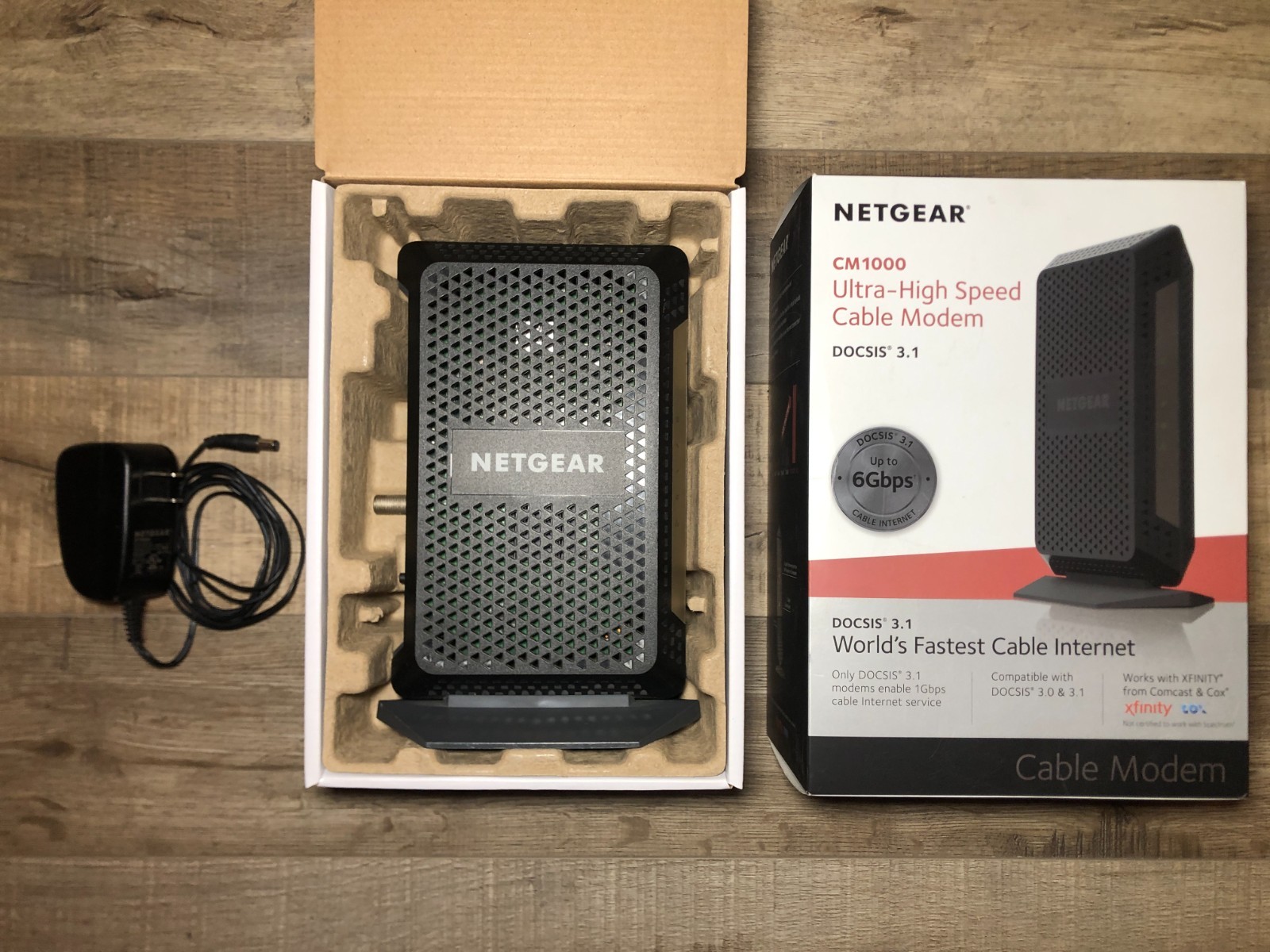 NETGEAR CM1000 1AZNAS Ultra-High Speed DOCSIS 3.1 Cable Modem with Charger & Box