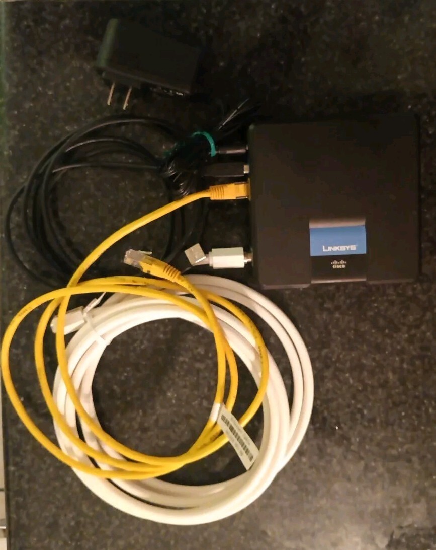 LINKSYS USB/Ethernet/Coax Modem CM100 By CISCO w/Cables, Power Supply,Manual