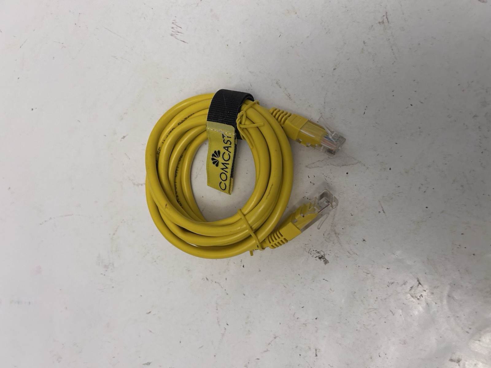 yellow comcast ethernet cord wrapped