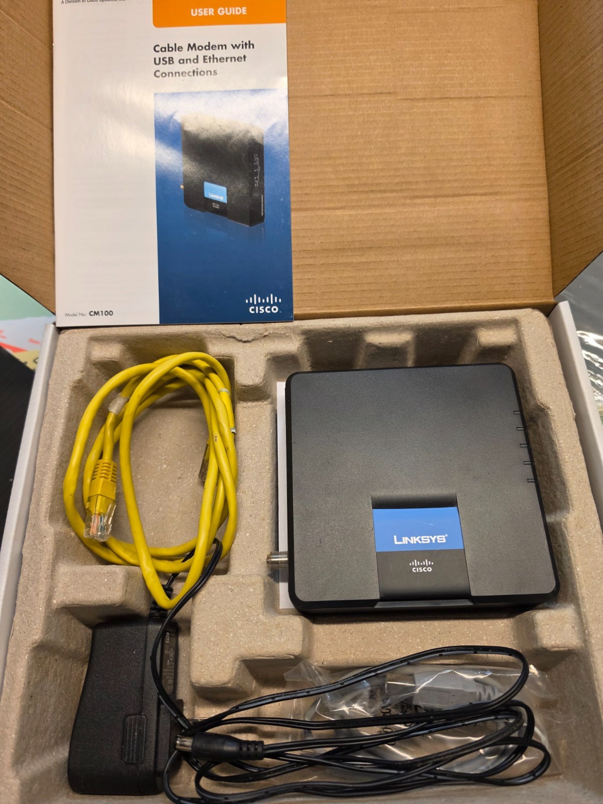 LINKSYS CISCO CM100 DOCSIS 2.0 CABLE MODEM COMPLETE IN BOX w/CD CABLES MANUAL