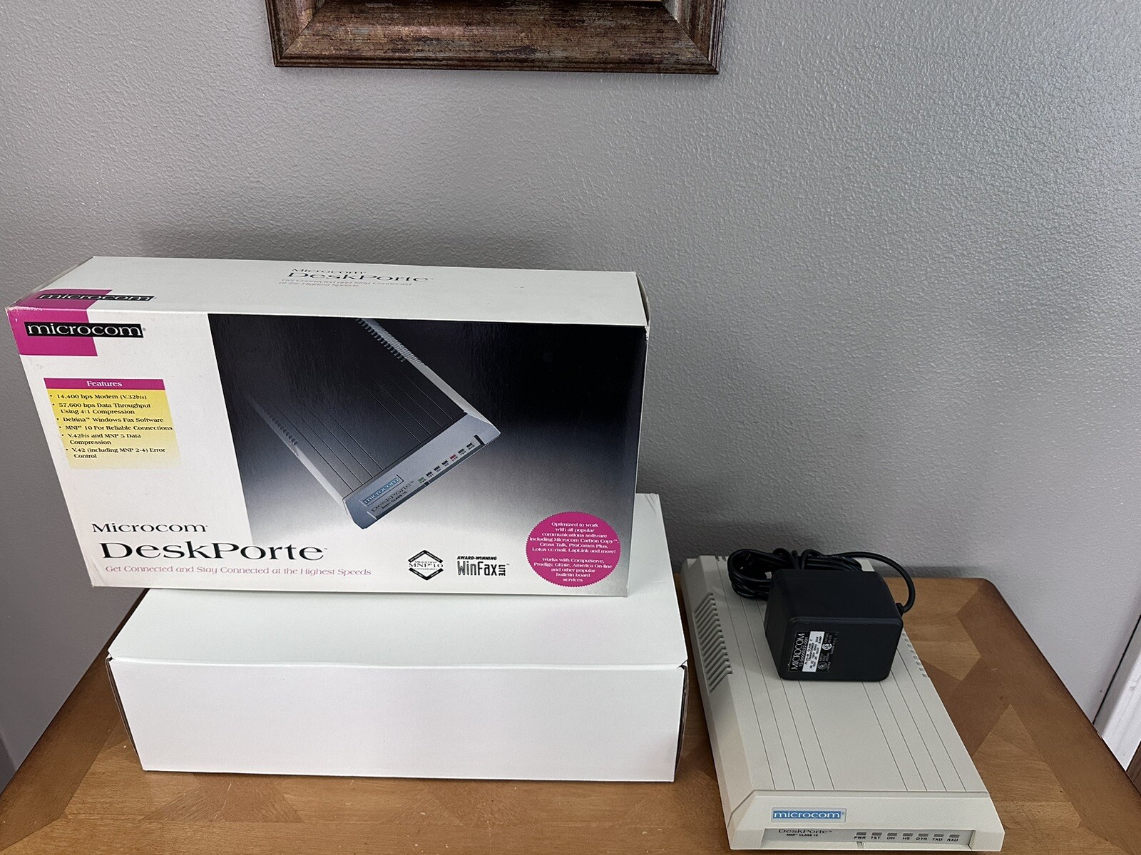 Microcom DeskPorte 14,400 bps Modem W/ Box And Charging Cord.