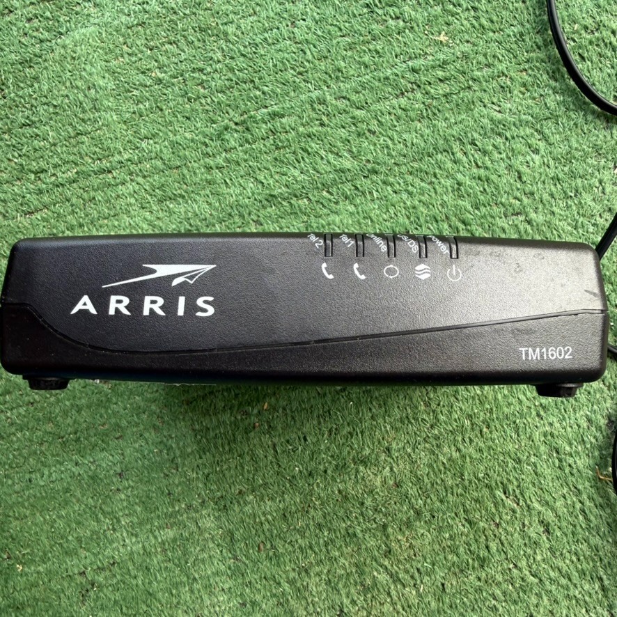 ARRIS TM1602A Cable Modem DOCSIS 3.0 with power cord.