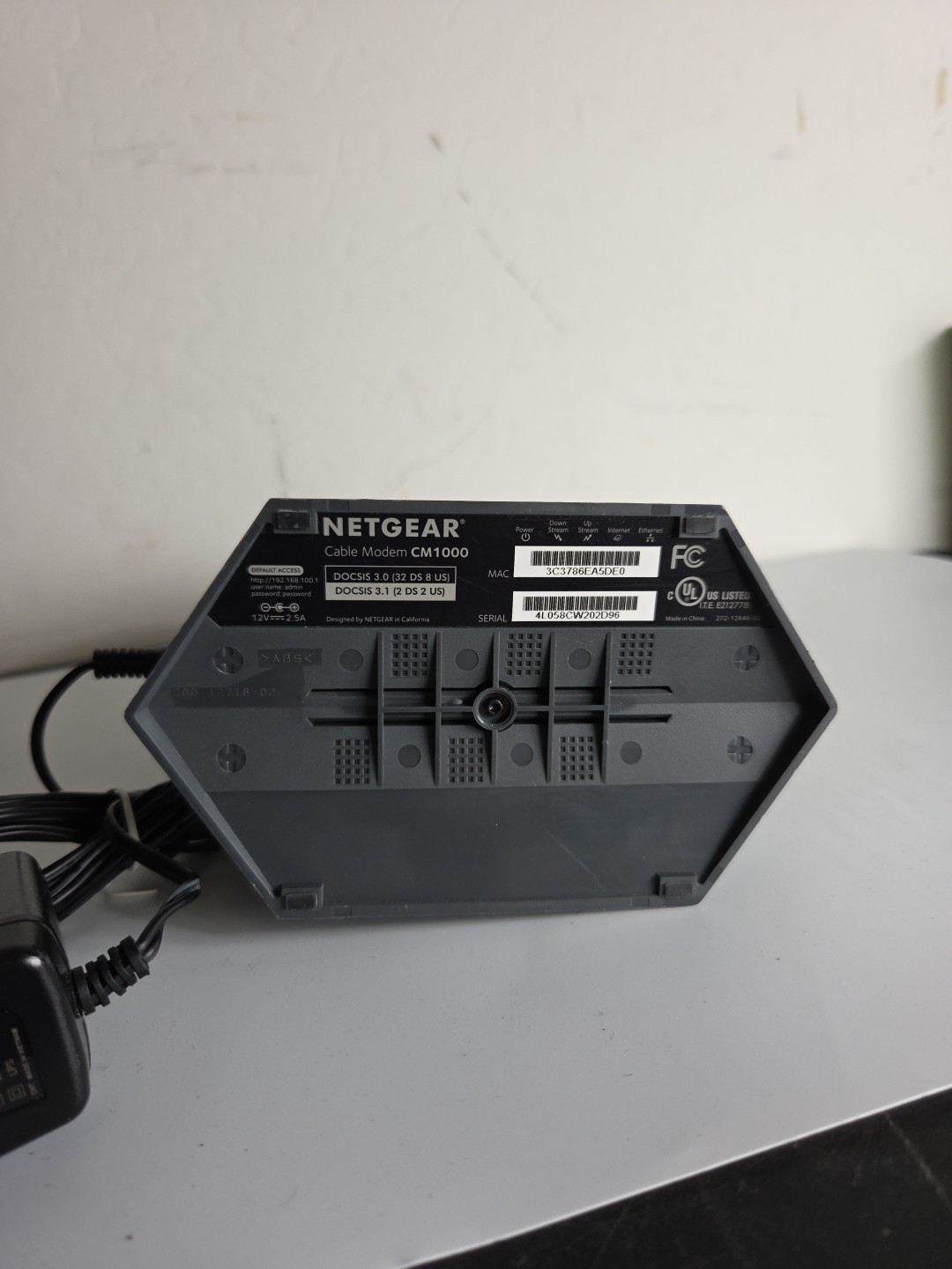 Working NETGEAR CM1000 Cable Modem with power cord and eithernet cable