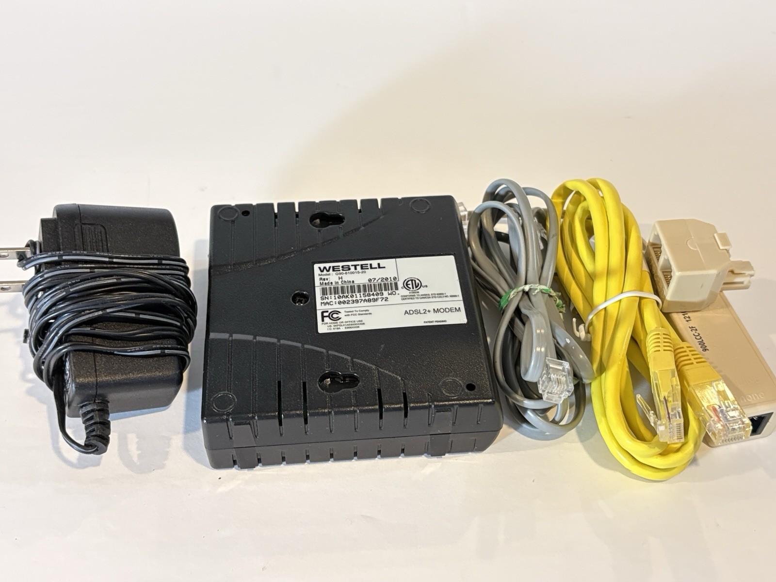 WESTELL G90-610015-20 ADSL2+ MODEM ( W/CORD & CABLES)