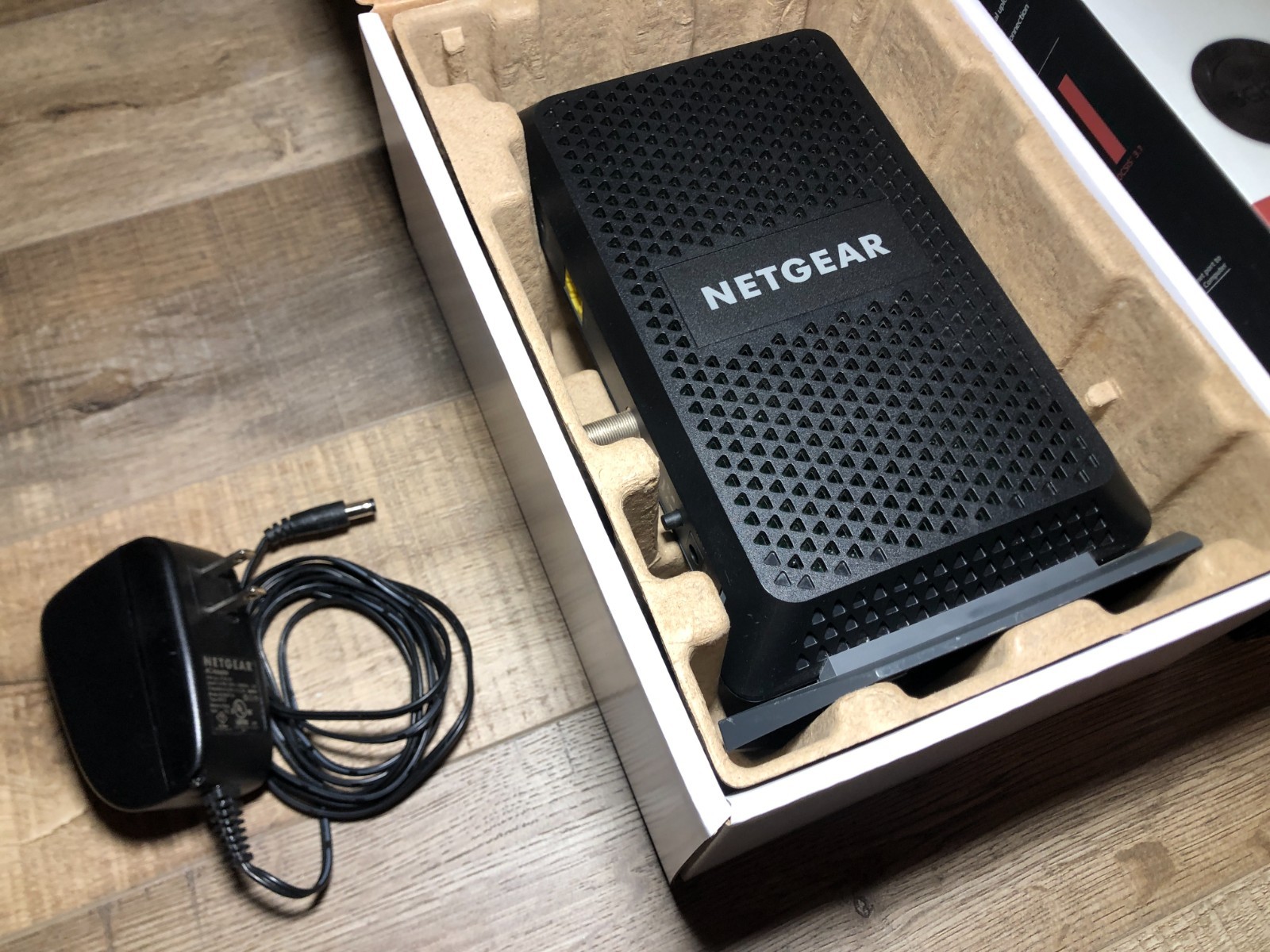 NETGEAR CM1000 1AZNAS Ultra-High Speed DOCSIS 3.1 Cable Modem with Charger & Box