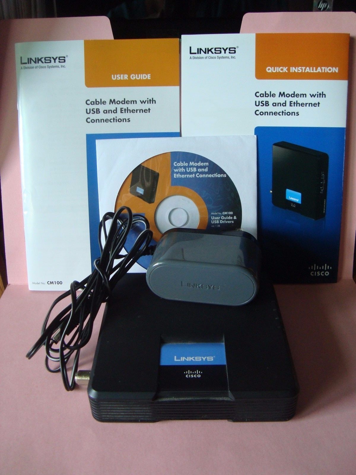 Cisco Linksys Model# CM100 Cable Modem Power Adapter Ethernet Cable CD