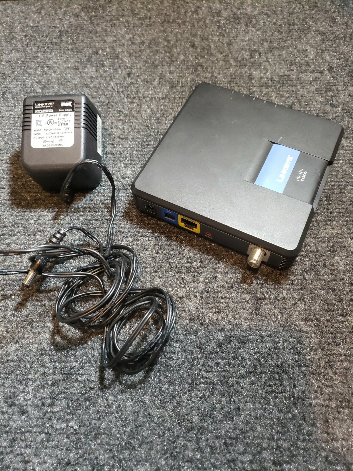 Cisco Linksys CM100 100 Mbps Cable Modem + Adapter – Used