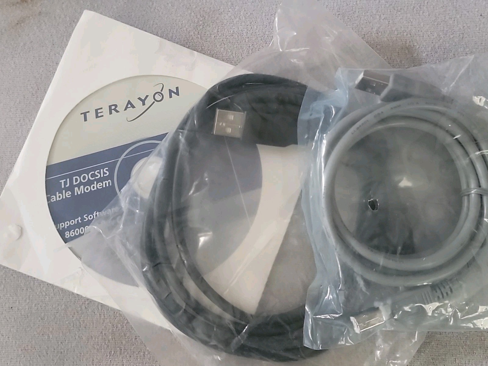 Terayon TJ-615 Blue DOCSIS Cable Modem Bundle – Open Box / Sealed Cables & CD