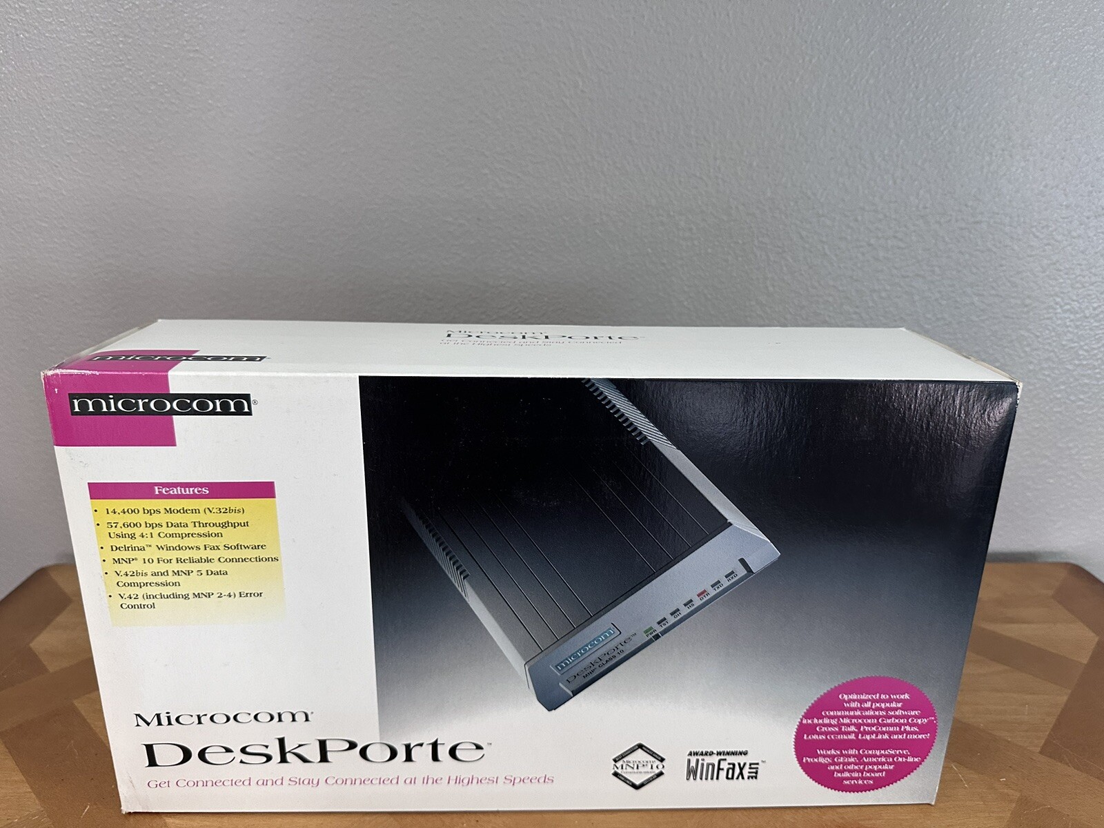Microcom DeskPorte 14,400 bps Modem W/ Box And Charging Cord.