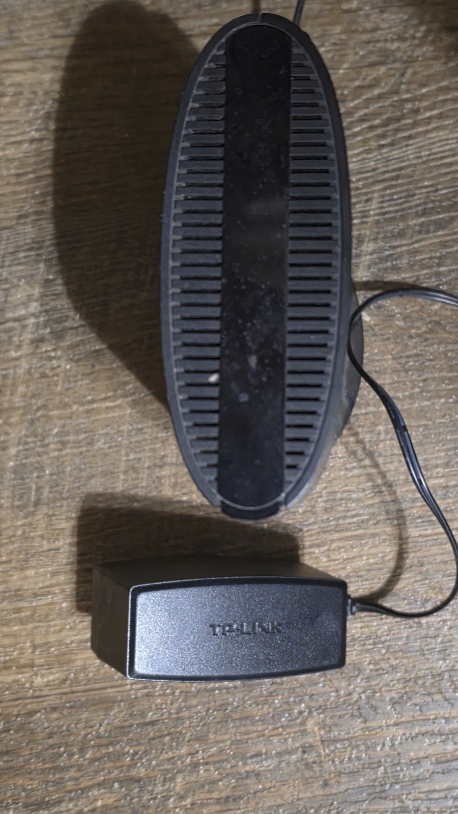 TP-LINK TC-7610 DOCSIS 3.0 Cable Modem with power adapter.