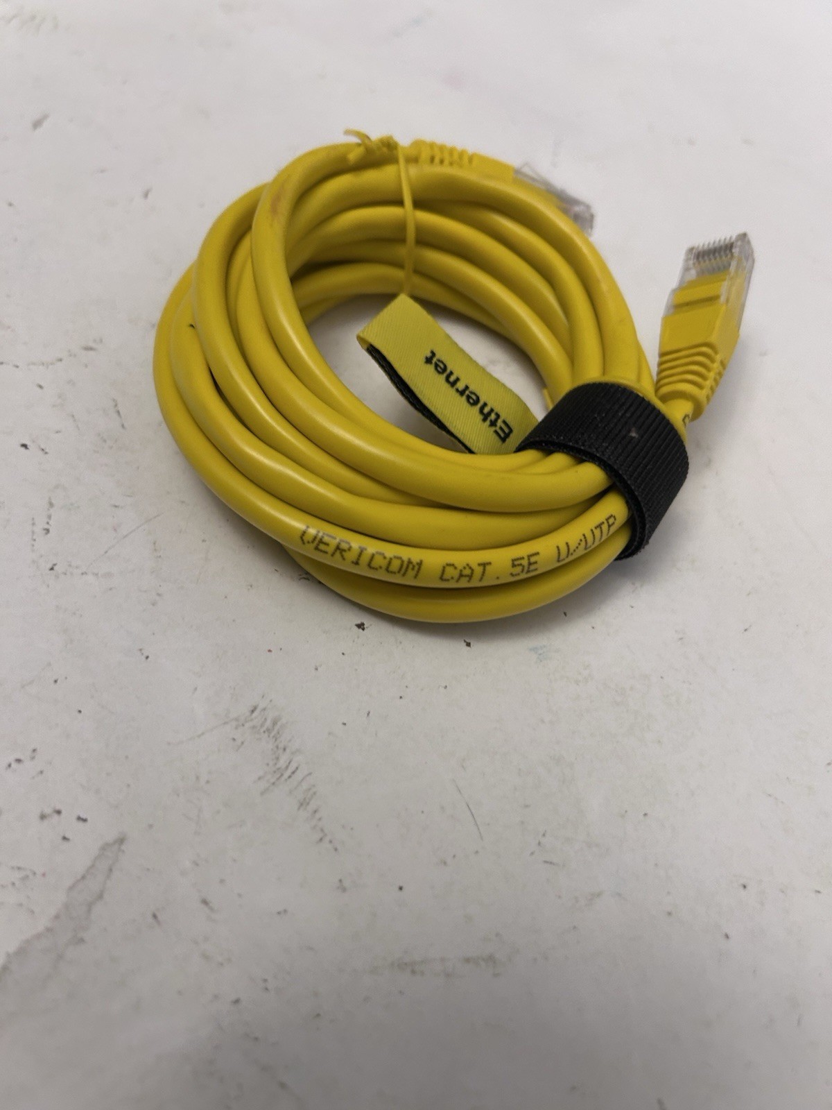 yellow comcast ethernet cord wrapped