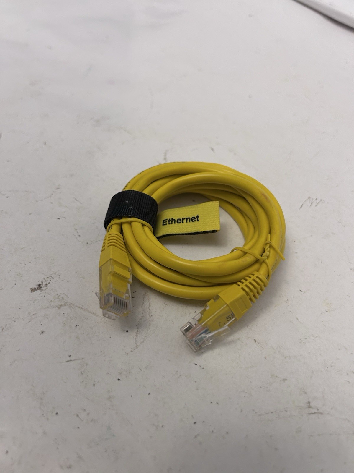 yellow comcast ethernet cord wrapped