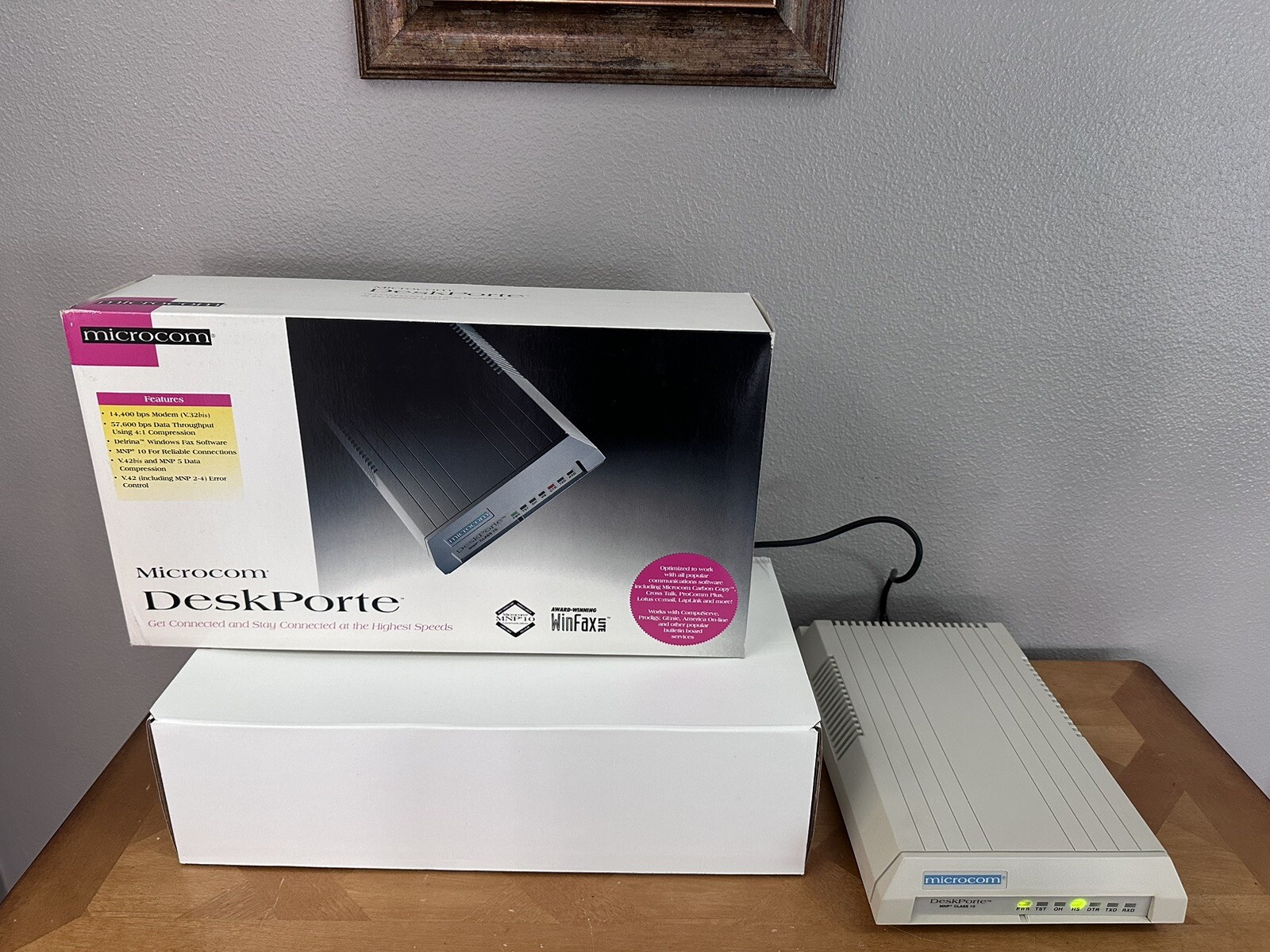 Microcom DeskPorte 14,400 bps Modem W/ Box And Charging Cord.