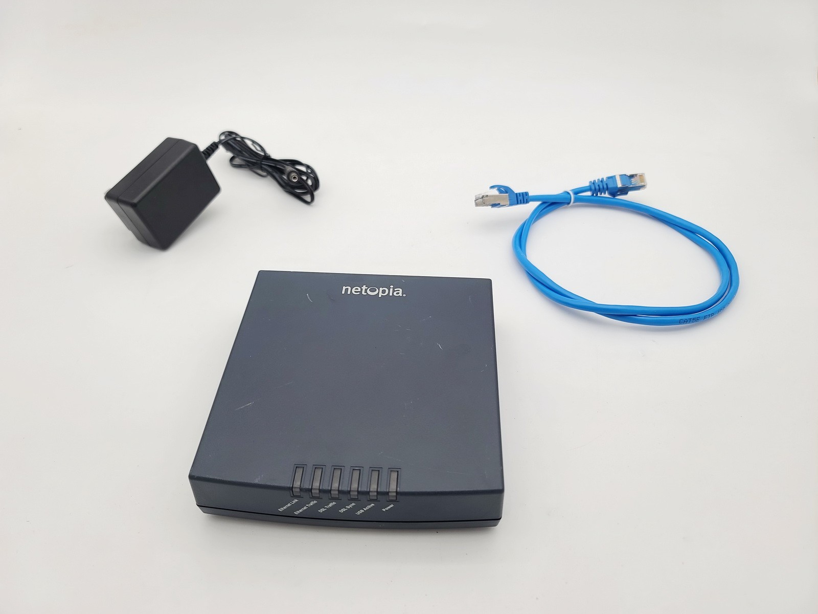 NETOPIA CAYMAN 3300 3341-ENT 4-PORT 10/100 DSL MODEM AC ADAPTER INCLUDED