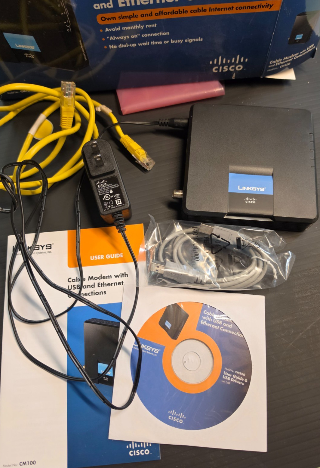 LINKSYS CISCO CM100 DOCSIS 2.0 CABLE MODEM COMPLETE IN BOX w/CD CABLES MANUAL