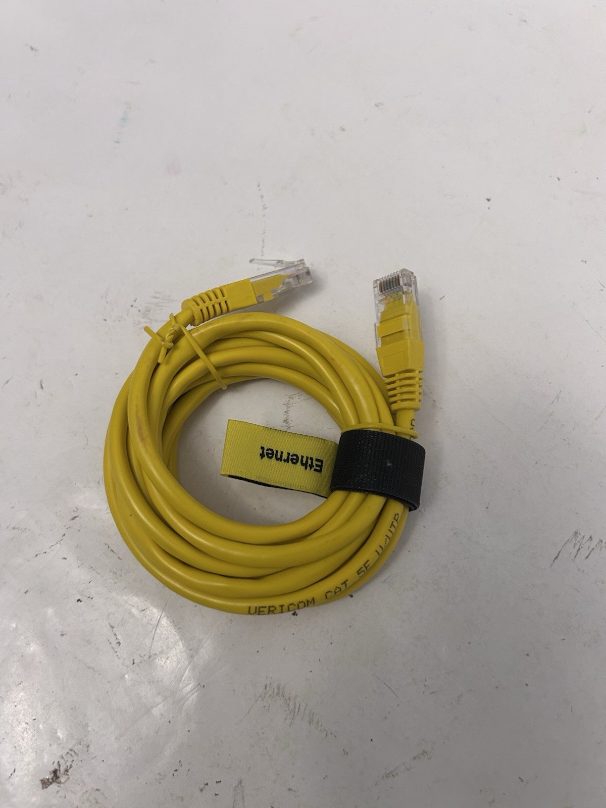 yellow comcast ethernet cord wrapped